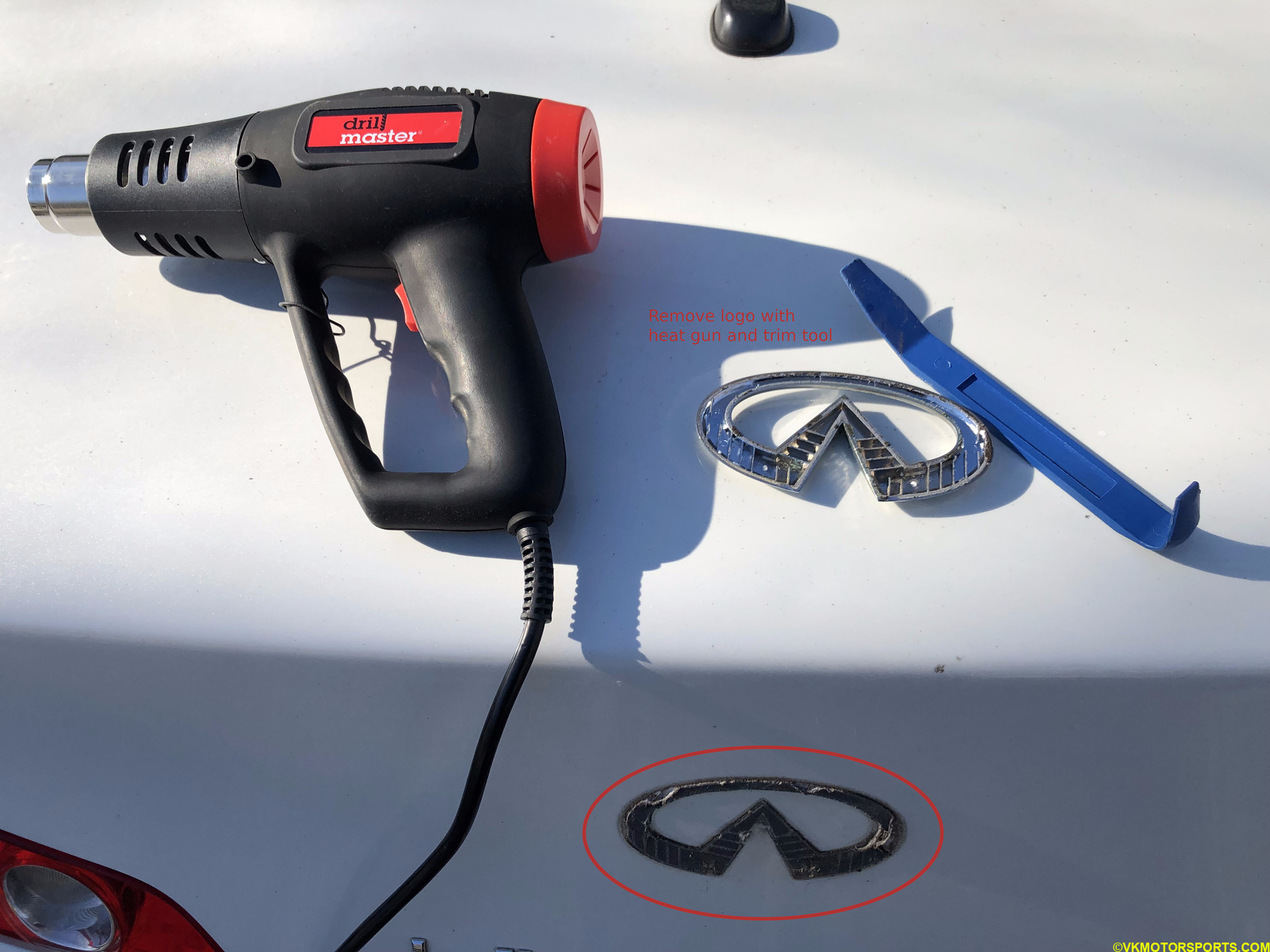 Figure 1. Using a heat gun remove attached emblem from trunk