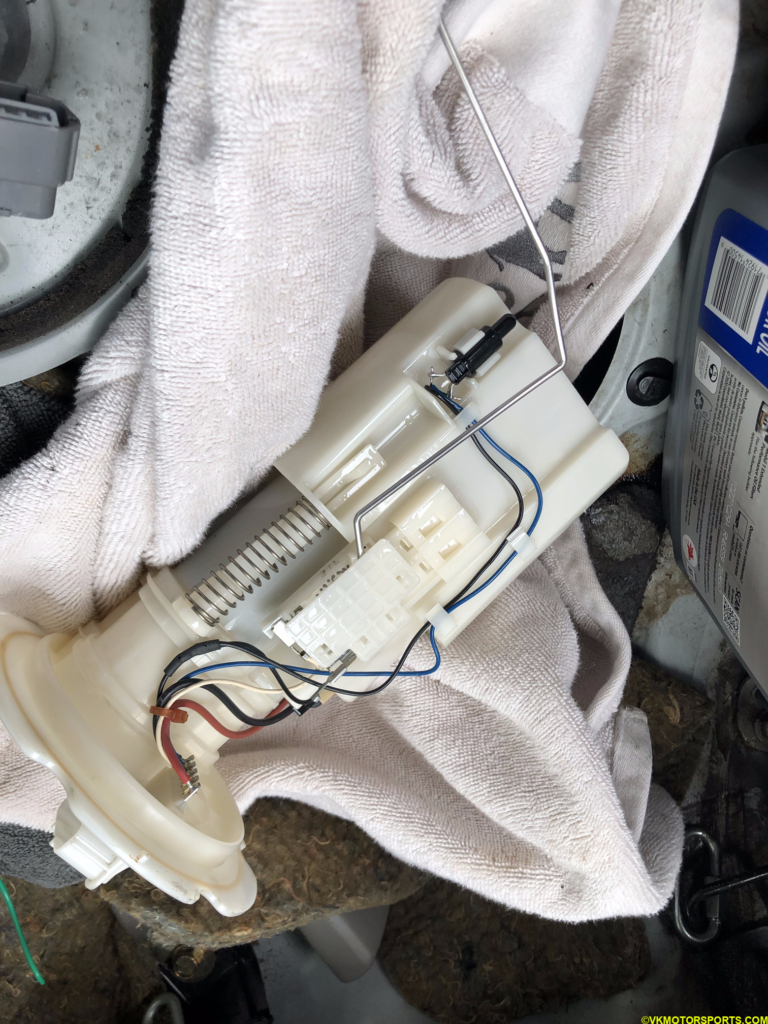 Figure 23. Slowly pull the fuel pump out and place on a clean towel