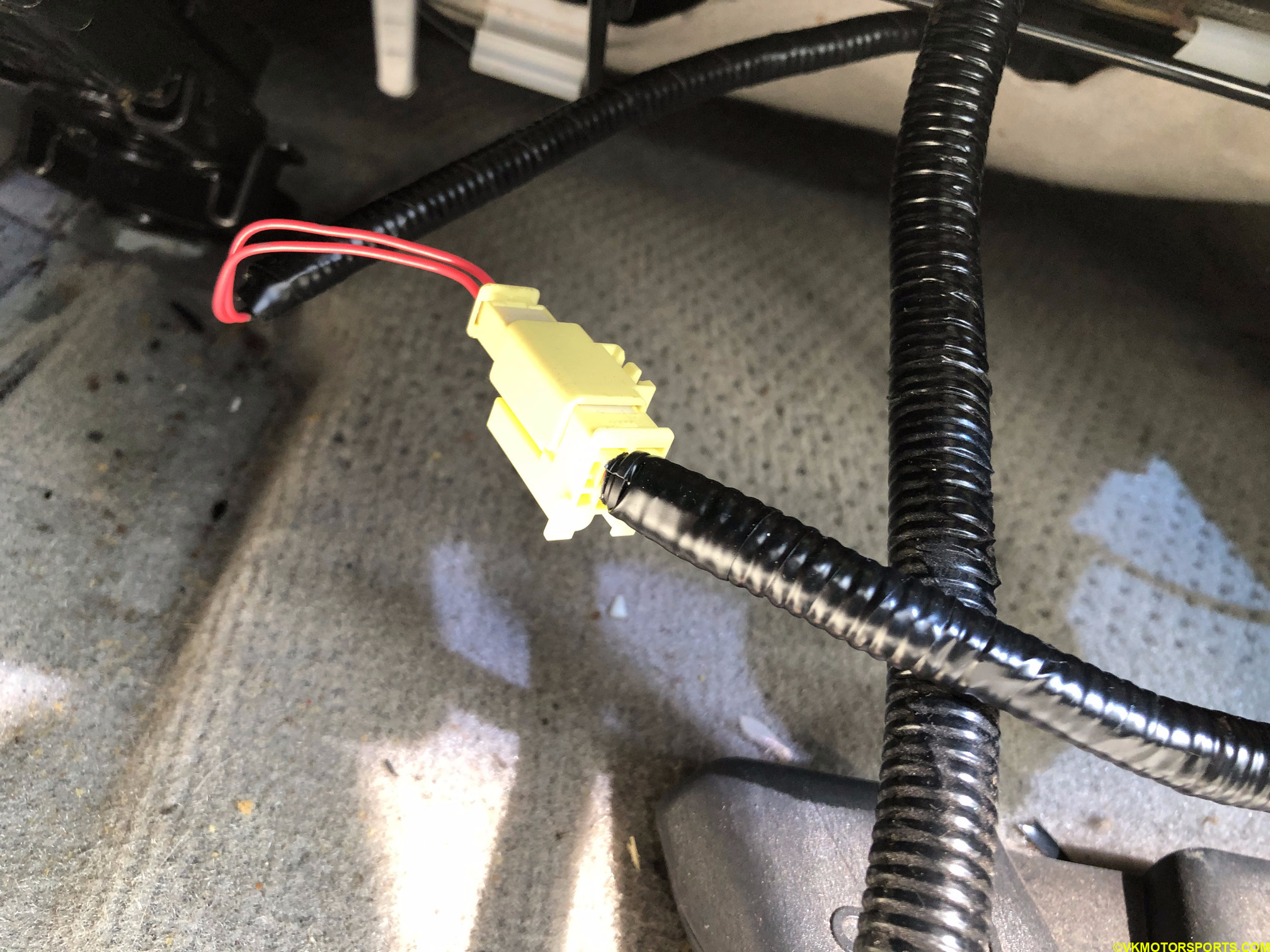 Figure 2. Locate the yellow airbag connector on the wiring harness