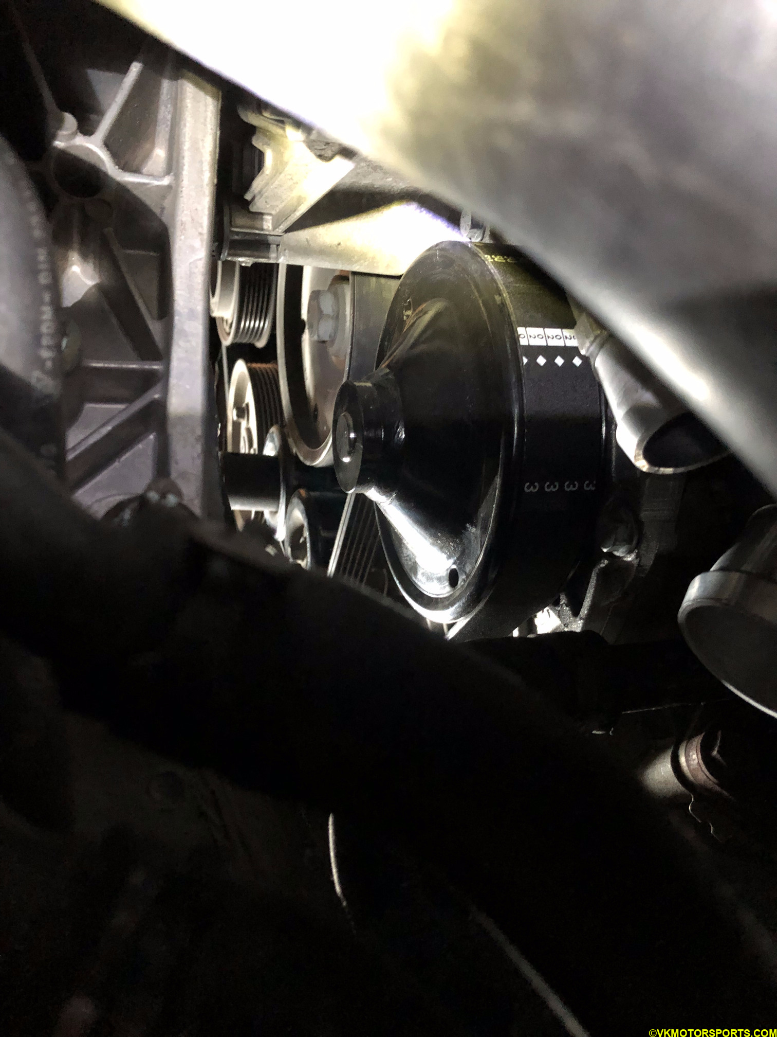 Figure 27a. Under-car view of the belt on the water pump