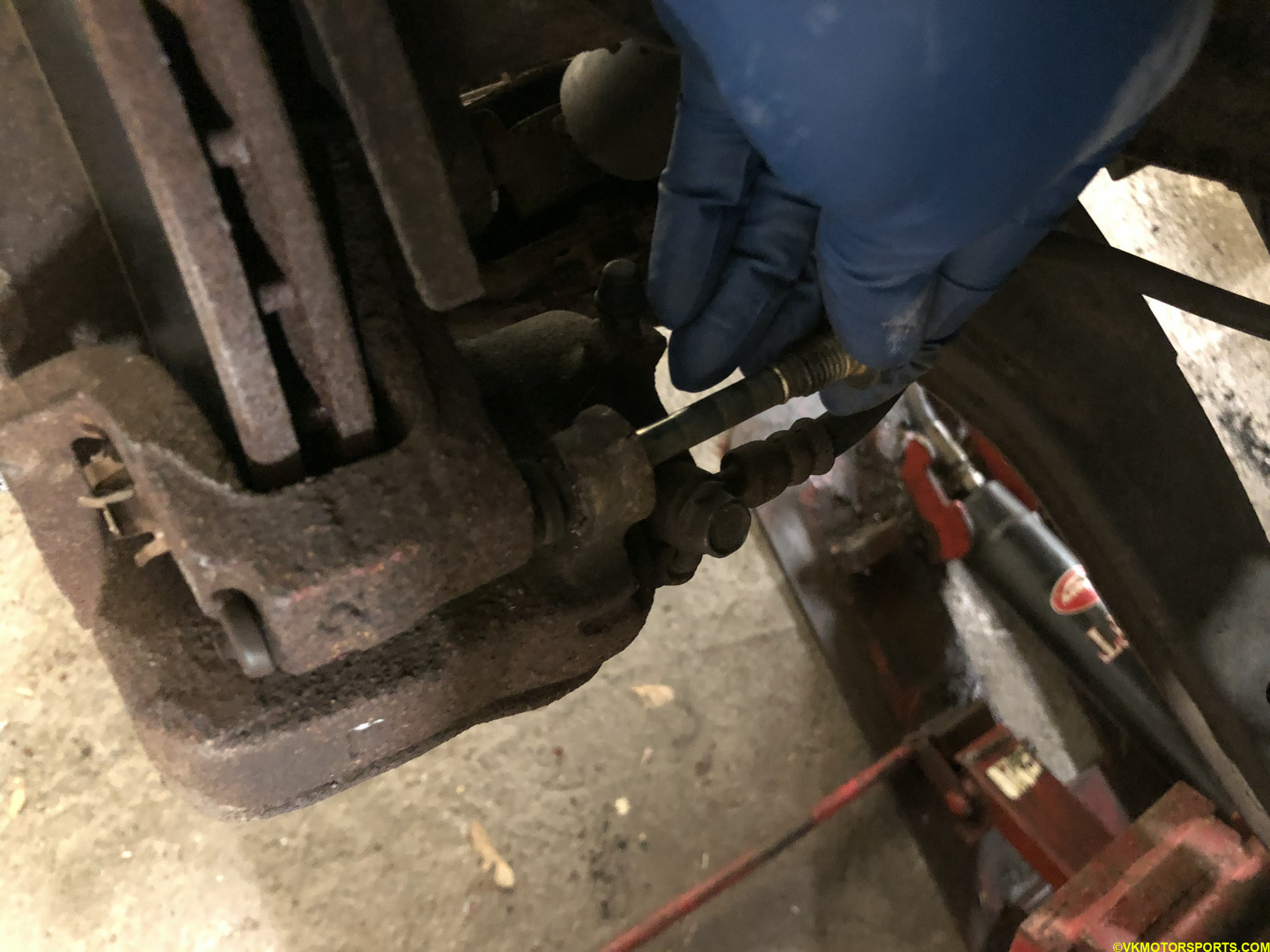 Figure 6. Pull out the caliper bolt