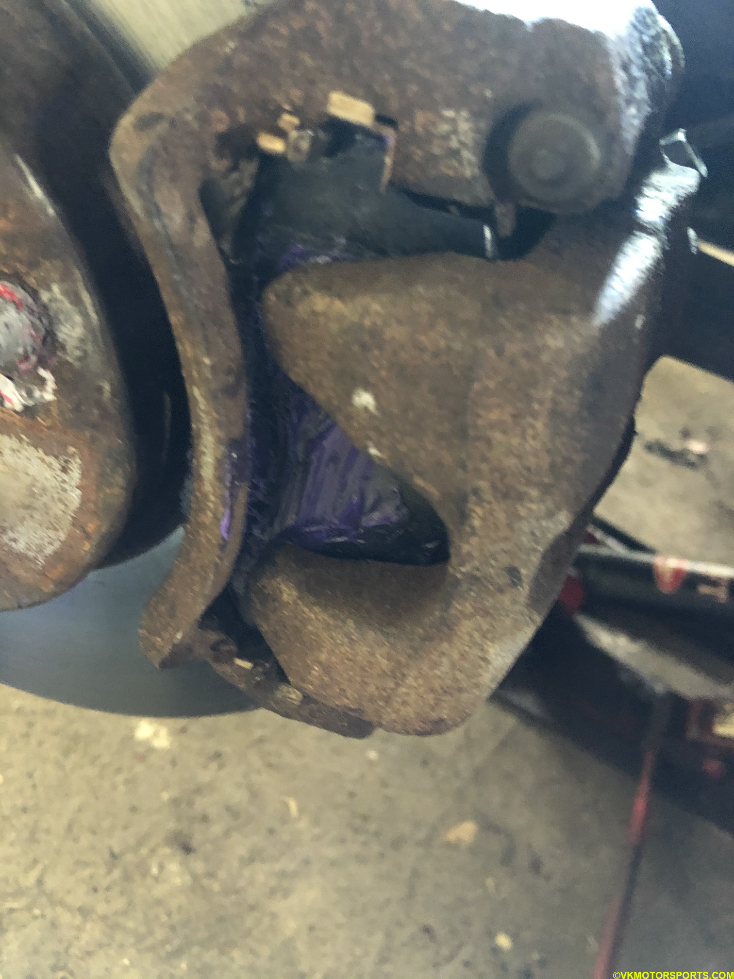 Figure 19. Driver side caliper with new pads
