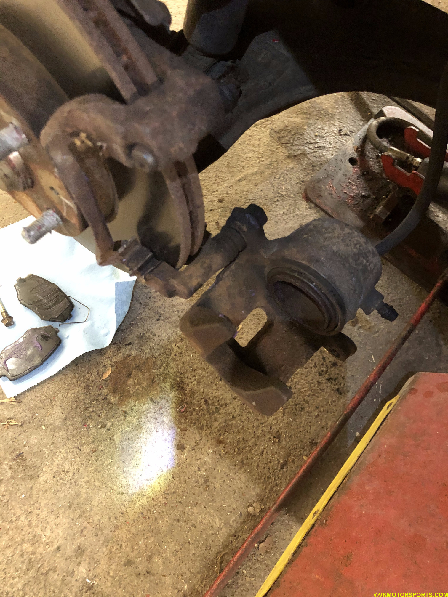 Flip the caliper open and remove brake pads