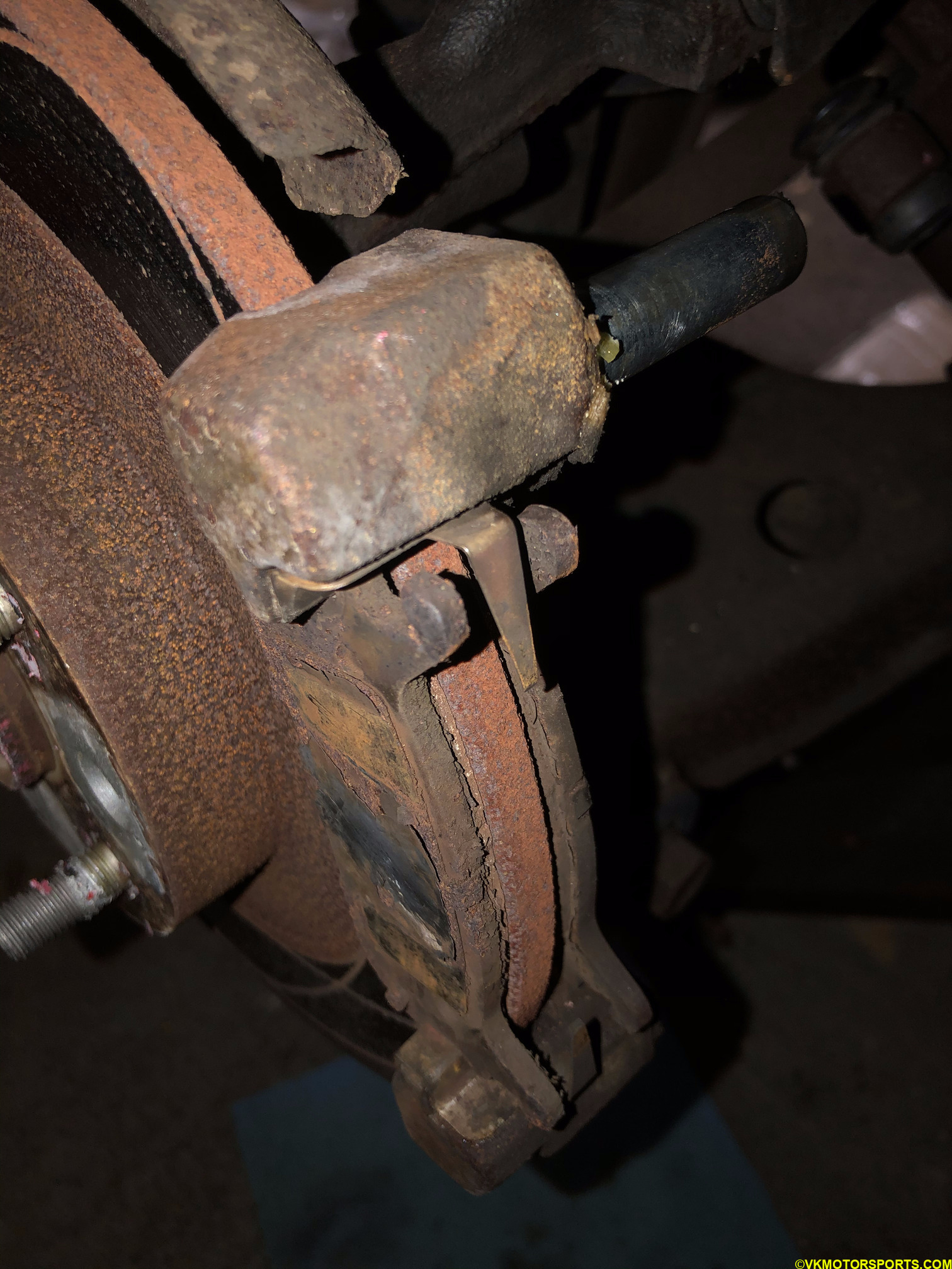 Remove the brake pads that are on the caliper bracket