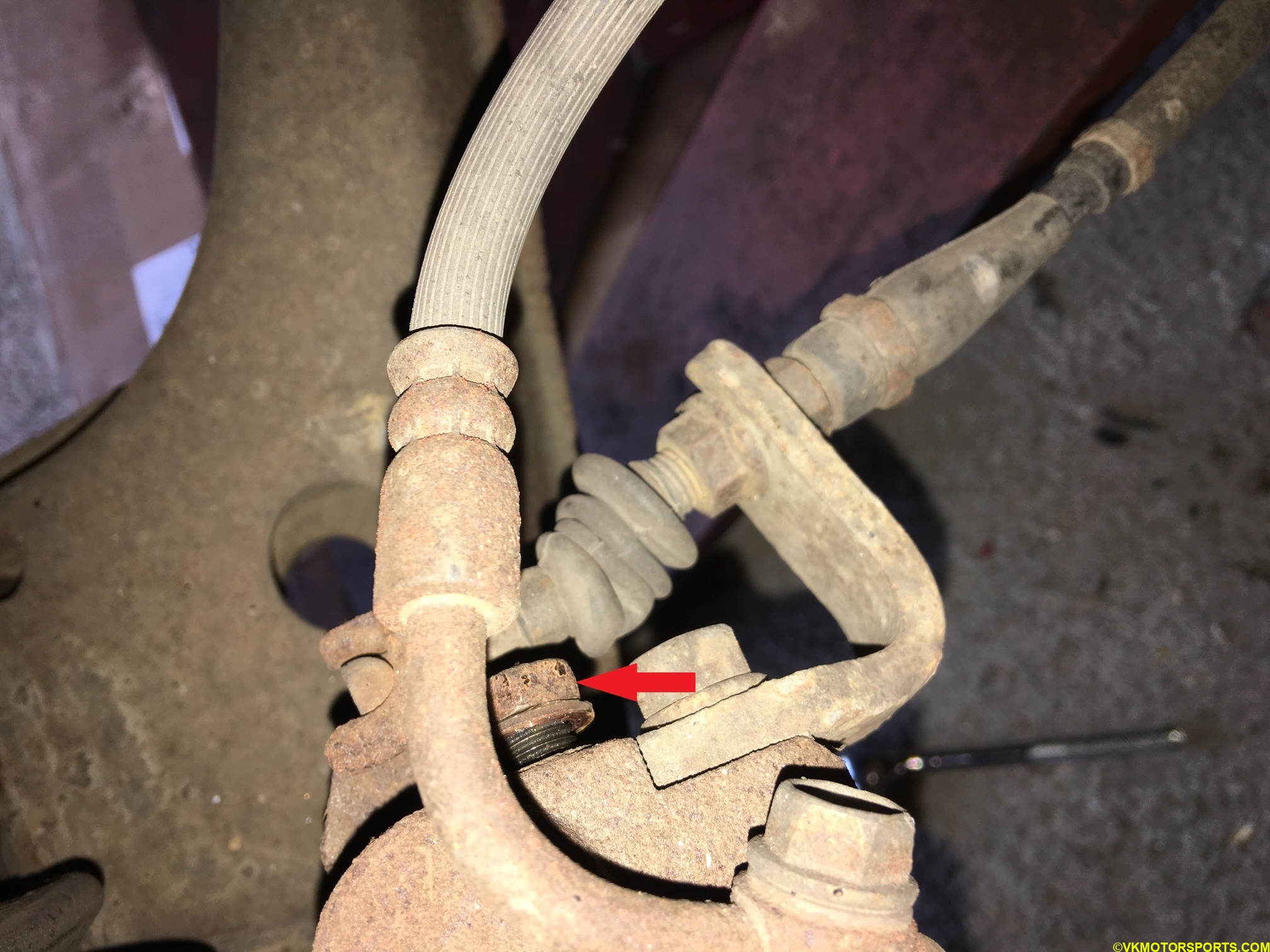 Figure 2. Remove the non-caliper bolt