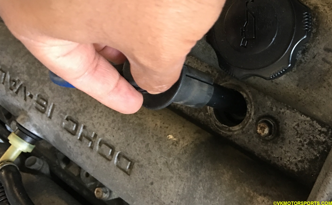 remove the spark plug boot