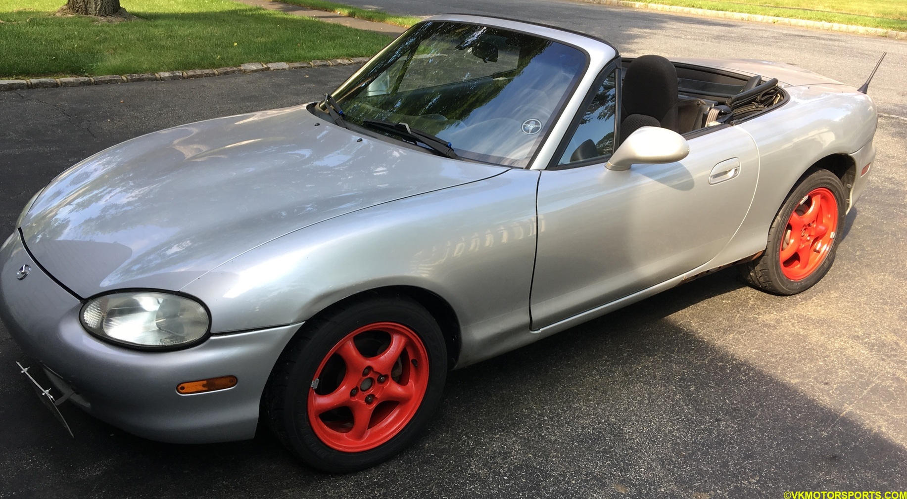 Figure 13. Driver side look of red wheels on silver car