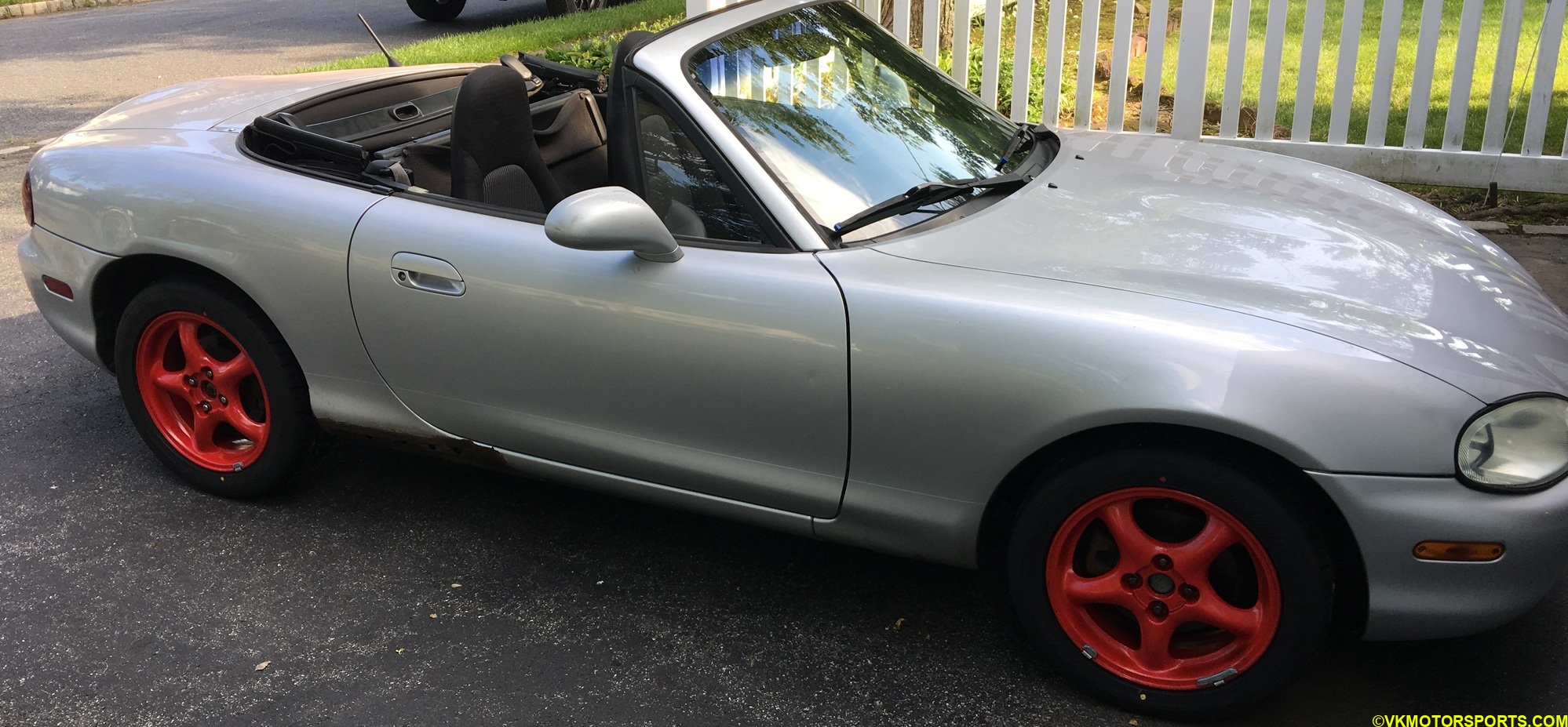 Figure 14. Passenger side look of red wheels on silver car