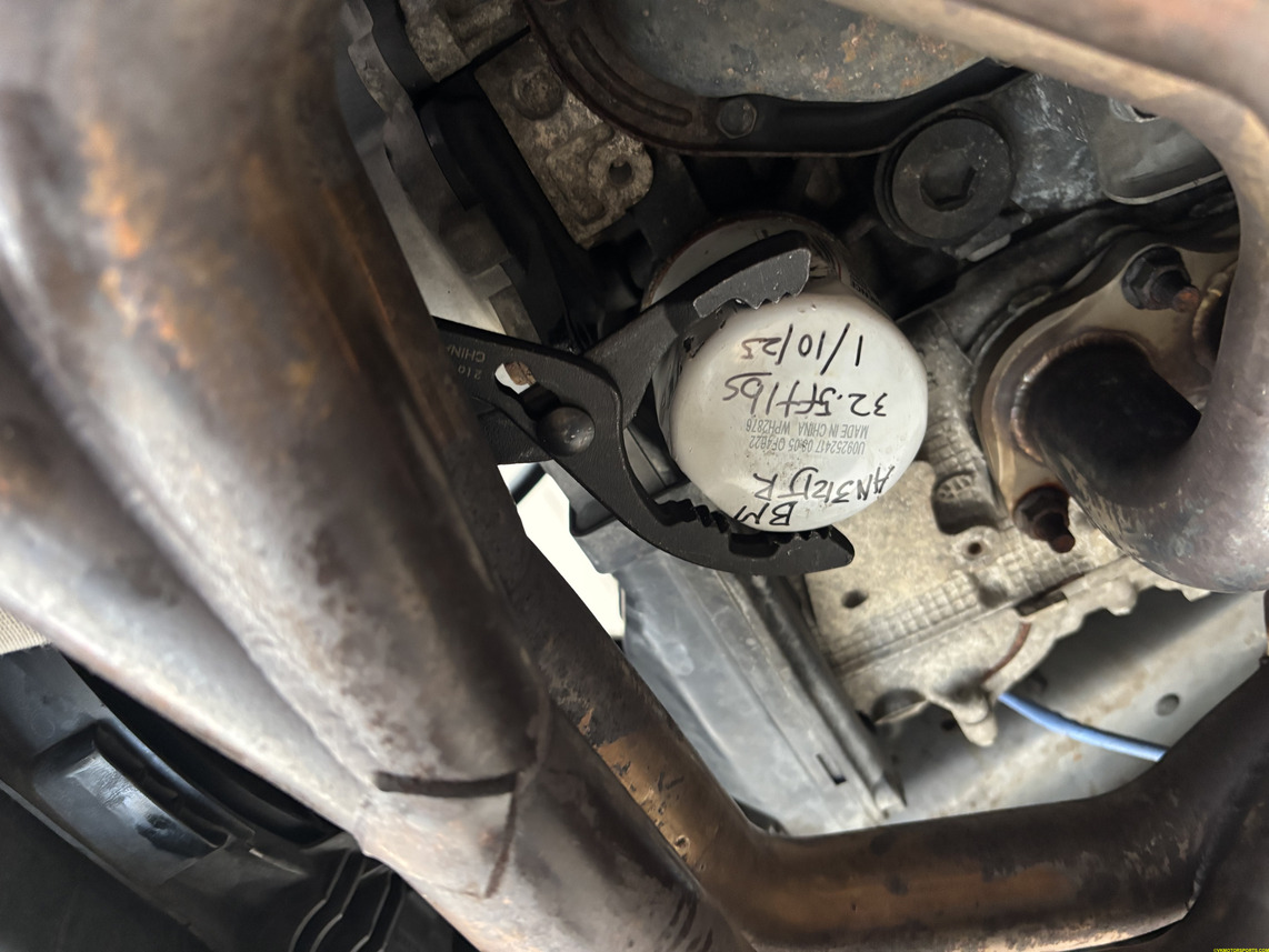 Figure 7. Remove the old oil filter with an oil filter pliers